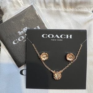 Coach rose, gold necklace, and earrings set